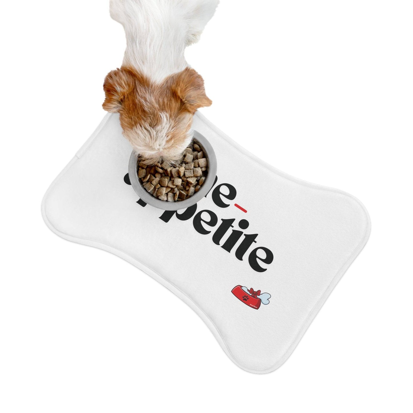 Dog eating from a bowl placed on a white 'Bone-Appetite' pet feeding mat, designed for keeping meal areas clean and stylish.